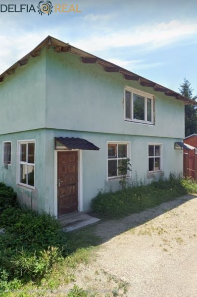 A cottage on Albaregia Street in Jahodná with a plastered facade and wooden doors.