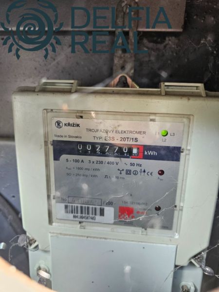 Three-phase electricity meter by Krížik, type E3S-20T/1S, measuring consumption in kWh.
