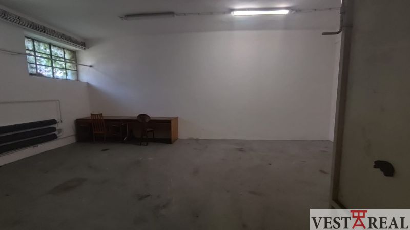 Spacious room with a desk and chair in Warehouses and Halls.