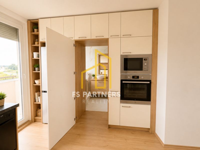 A kitchen with white cabinets and appliances, a floor with a wood decor, a 3-room apartment.