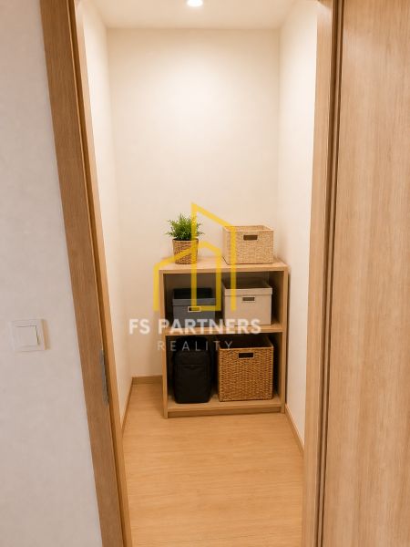 Storage space in a 3-room apartment with shelves and boxes, floor with wood decor.