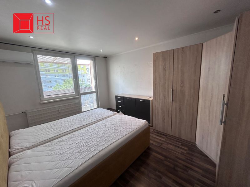 A bedroom with two mattresses and a wooden decor floor in a 3-room apartment.