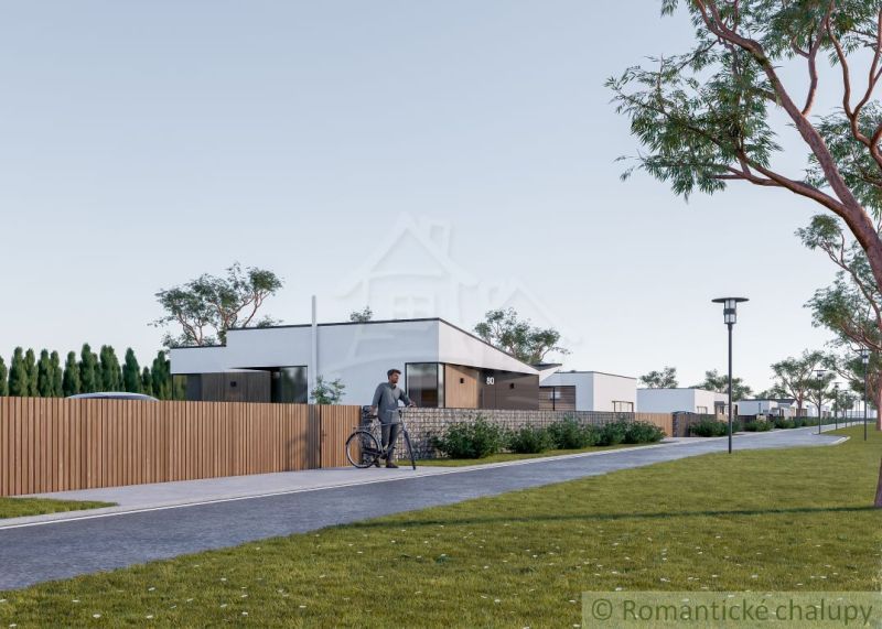 The cycling route runs alongside modern houses in Nové Zámky, Residential plots.