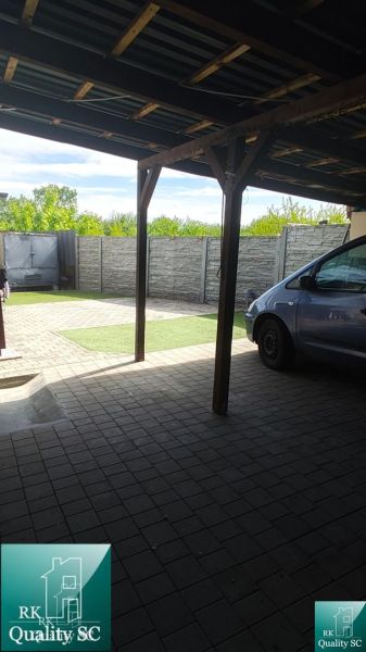 Carport at a family house on Mlynska Street in Blatne with a paved area.