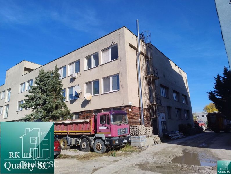 Building at Staviteľská Street in Bratislava III, warehouses and halls, trucks.