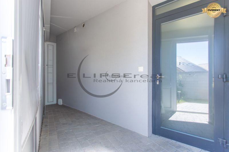 Entrance hallway with glass doors in a family house in Stupava.
