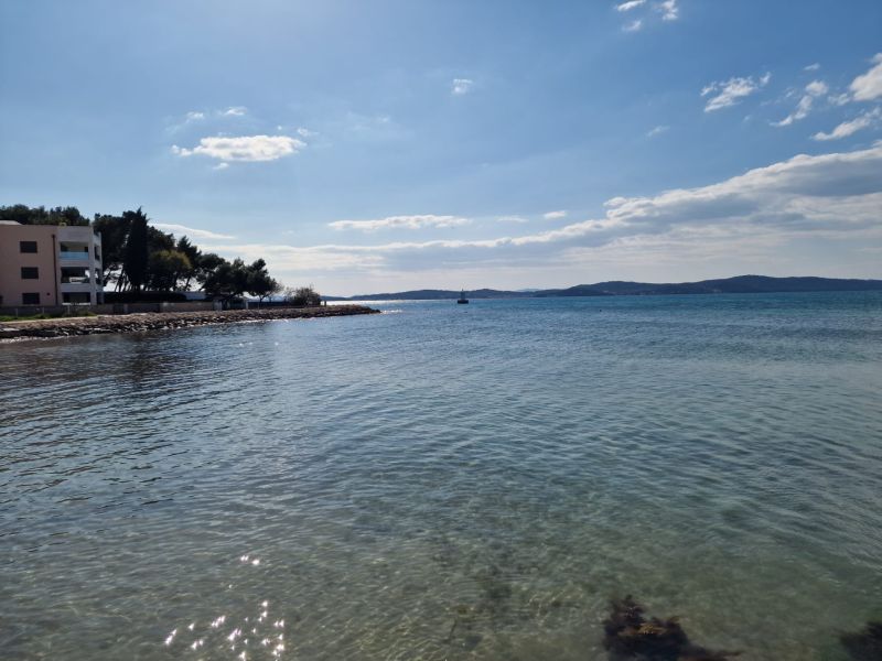 Coastal scenery with gentle waves in Sukošan by the Adriatic Sea.
