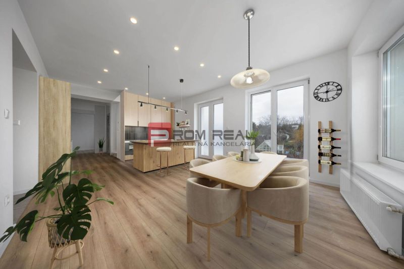Dining room with kitchen in a family house, table, chairs, bar, and floor with wooden decor.