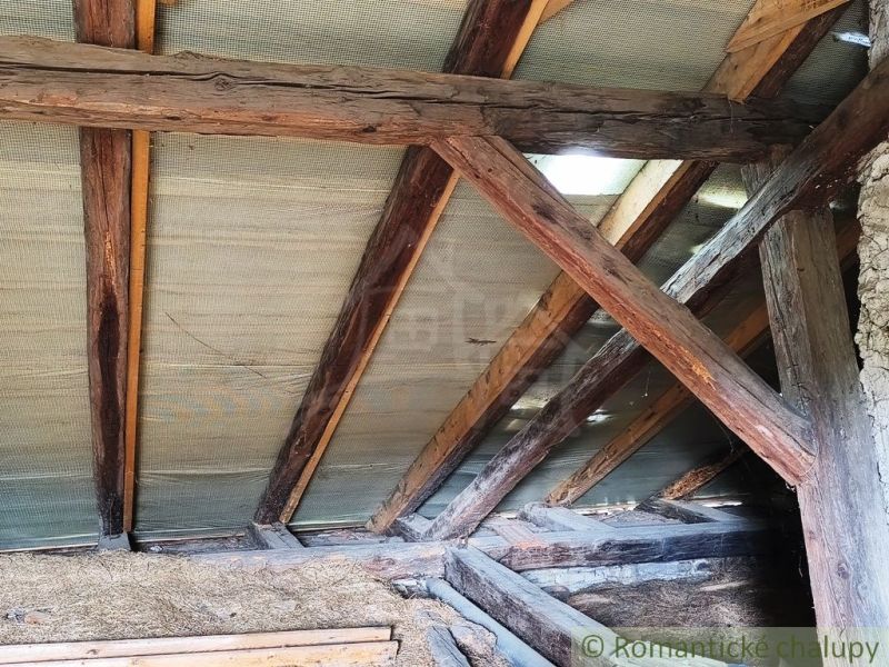 A view of the wooden beams of the ceiling in a cabin in Hermanovce.