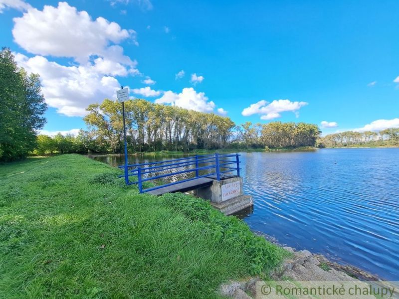 Beautiful landscape by the water in Hruboňovo, Gardens with a blue bridge.