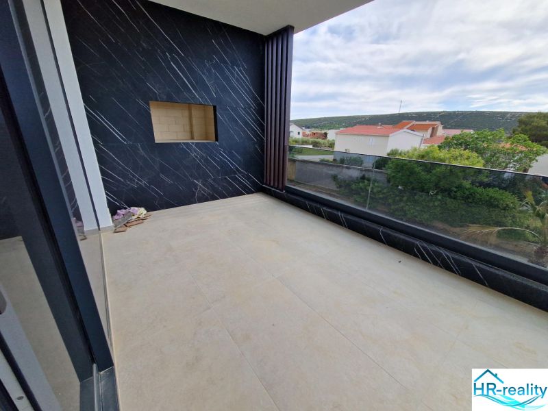 A holiday apartment in Stara Novalja with a spacious terrace and panoramic view.