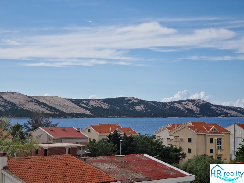 Sea view and rooftops in Stara Novalja from the Holiday Apartment.