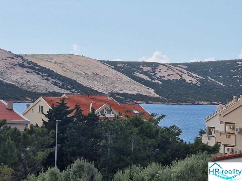 A view of the sea and houses in Stara Novalja from a holiday apartment.