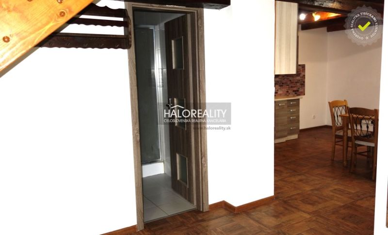 The interior of a family house with a wooden decor floor and wooden elements.