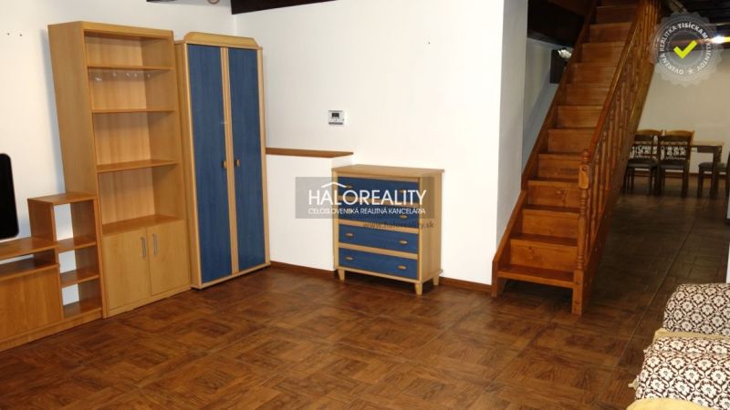 Interior of a family house with a wooden staircase and a floor with a wooden decor.