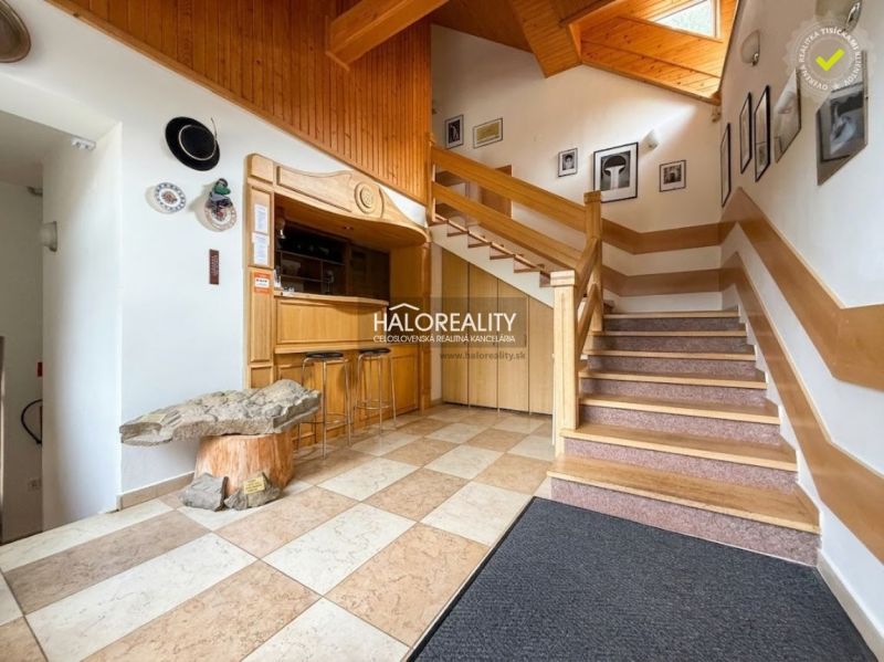 Wooden staircase with a bar and decorative table in city hotels and guesthouses.