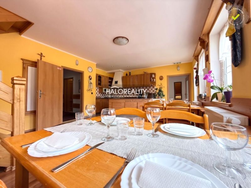 Dining room with set tableware in the interior of hotels and guesthouses, floor with wooden decor.
