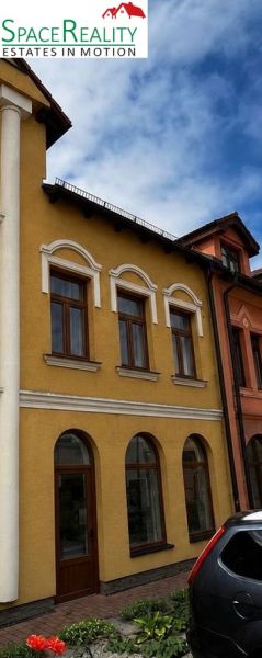 The building with a colorful facade and arched windows is located in Topoľčany.