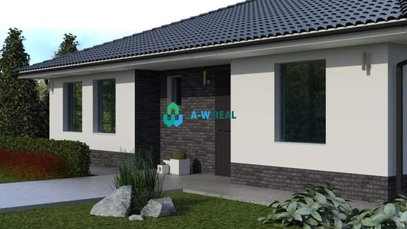 A family house in Povoda with a garden and a paved walkway, surrounded by flowers and shrubs.