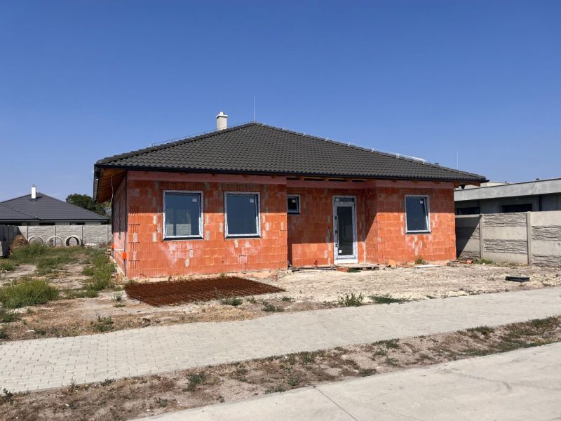 A family house in Povoda with construction modifications, a sloped roof, and a finishing facade.
