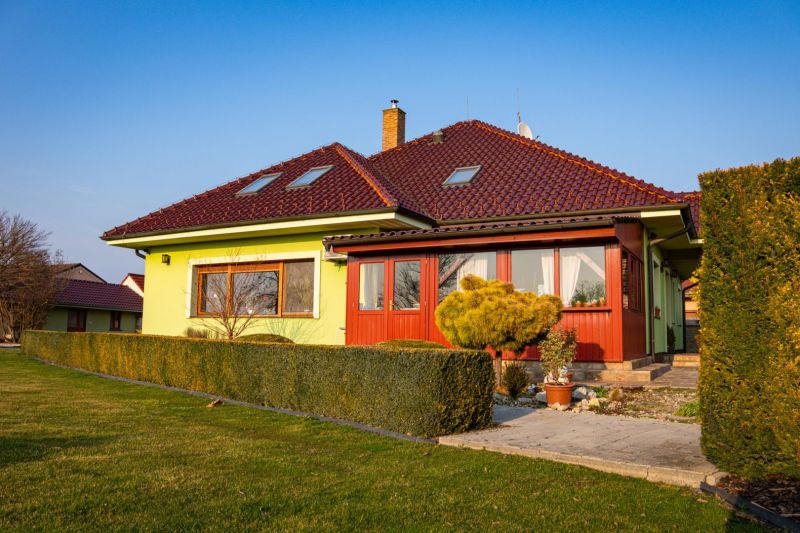 A family house in Dolný Bar on Dolný Bar Street, surrounded by a well-maintained green garden.