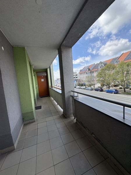 A balcony of an apartment building on Galantská Street in Dunajská Streda with a view of the street.