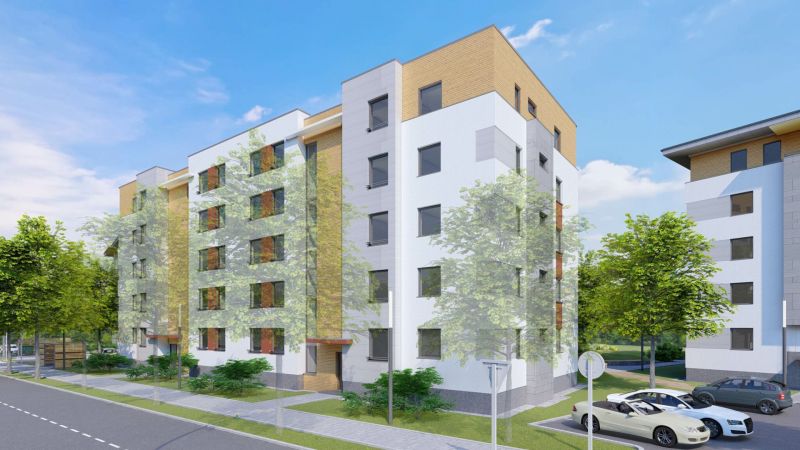 Apartment building in Dunajská Streda on an unspecified street with parking and greenery.