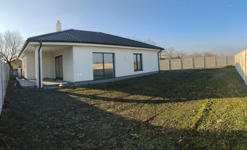 A family house in Michal na Ostrove with a garden, terrace, and pitched roof.