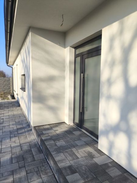 A family house in Michal na Ostrove with a terrace and glass doors.