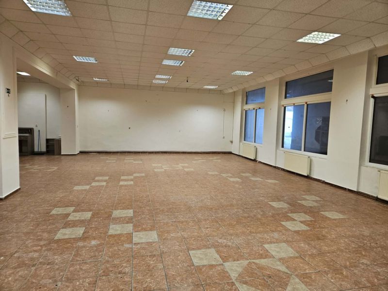 Spacious commercial spaces with tiling and lighting in the interior.