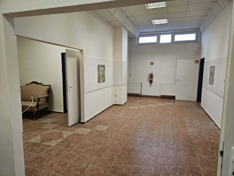 Commercial spaces with ceramic flooring and seating.