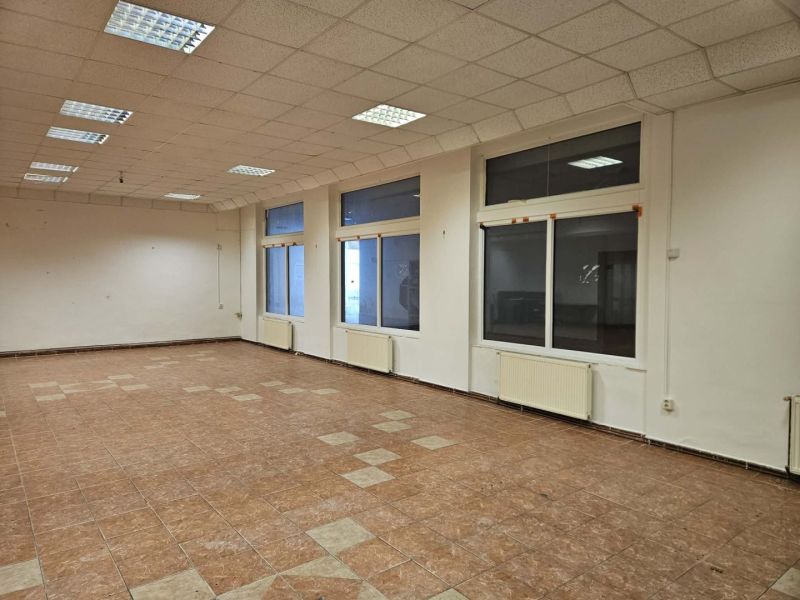 Spacious commercial spaces with large windows and tiling, ideal for business.