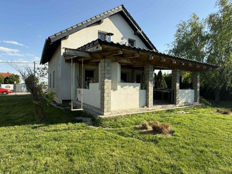 A family house in Dolný Štál with a terrace and a swing on a well-maintained lawn.