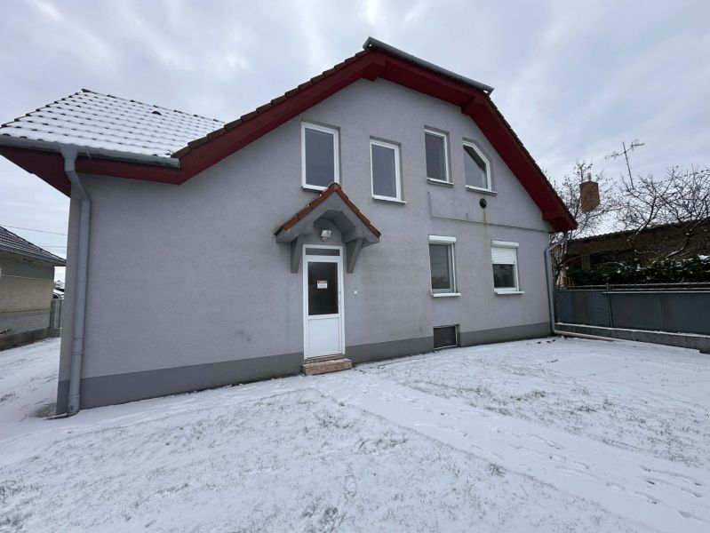 A family house in Dolný Štál with a white facade and a snowy yard.