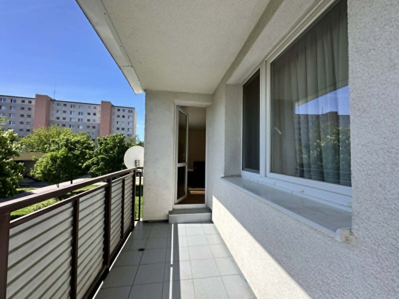 Balcony of a 3-room apartment on the street in Šamorín with a view of greenery.
