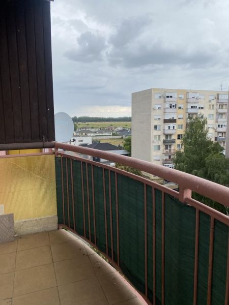 A view from the balcony of a one-room apartment in Dunajská Streda, overlooking residential blocks.