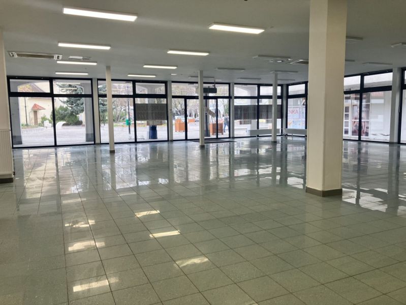 Spacious commercial spaces with glass walls and tiles, ideal for rent.