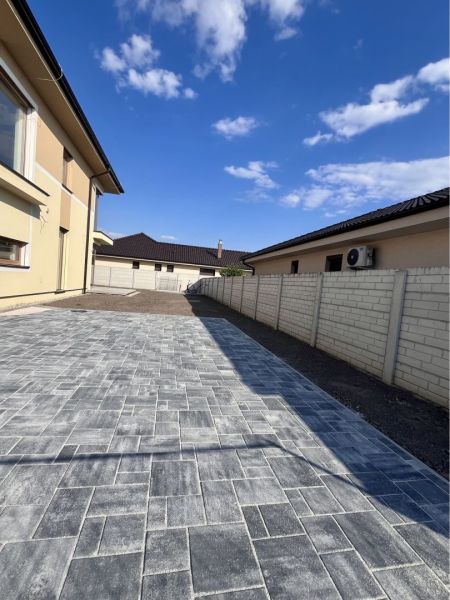 A family house in Dunajská Streda on GARDENTOWN street with a paved courtyard.