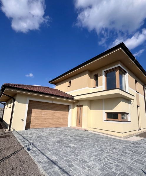 Family house on GARDENTOWN street in Dunajská Streda with a garage and paving stones.