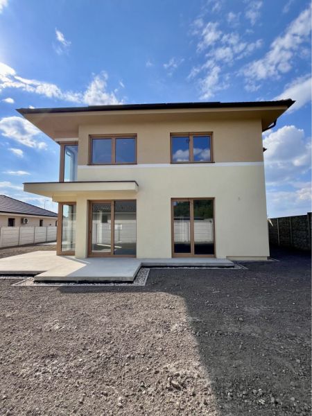 A family house on GARDENTOWN street in Dunajská Streda with a terrace and large windows.