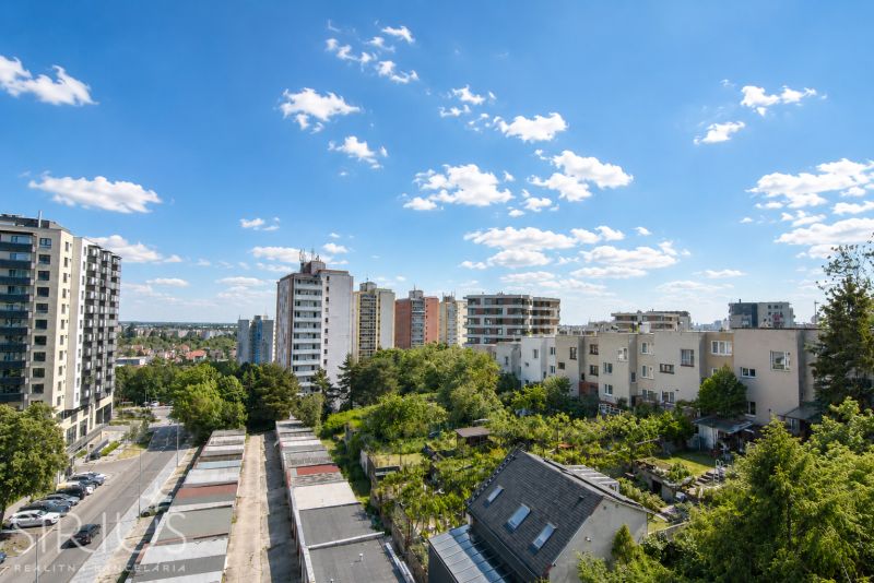 View of apartment buildings and greenery in Bratislava-Rača on Sadmelijská Street.