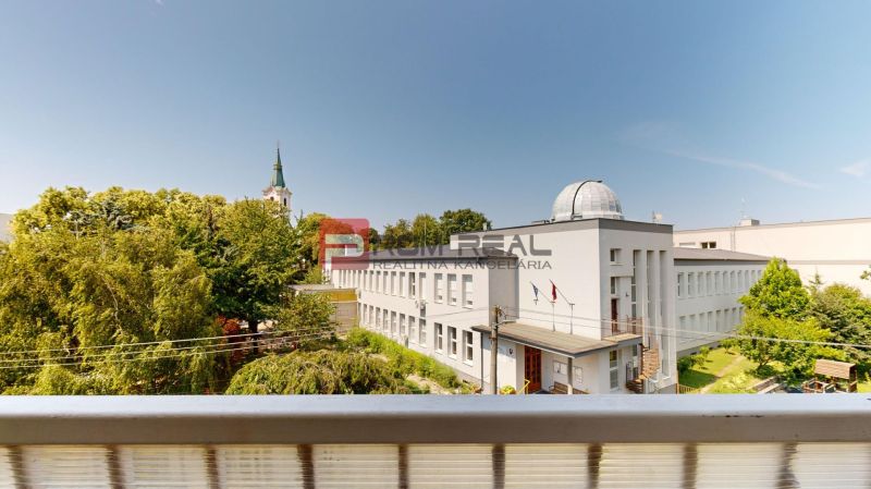 View from a 2-room apartment on Moyzesova Street in Senec with surroundings and trees.