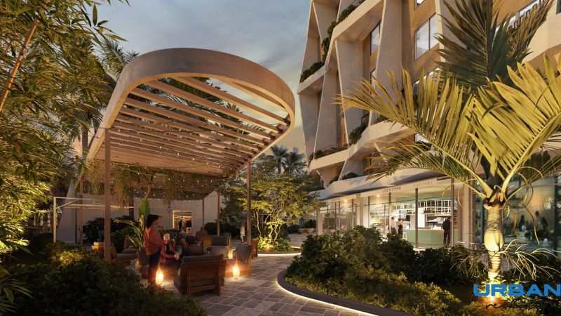 Construction of apartments on Paje Street in Unguja South with illuminated outdoor seating and greenery.