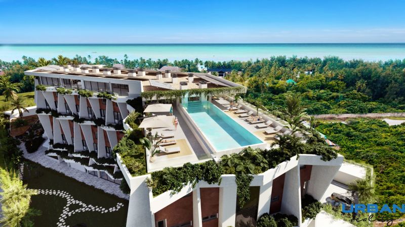 A building with a pool and sea view under construction of apartments in Paje, Unguja South.