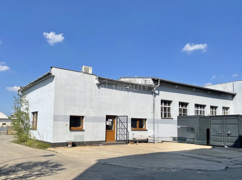 Exterior of office spaces in Žilina, a building with a white facade and windows.
