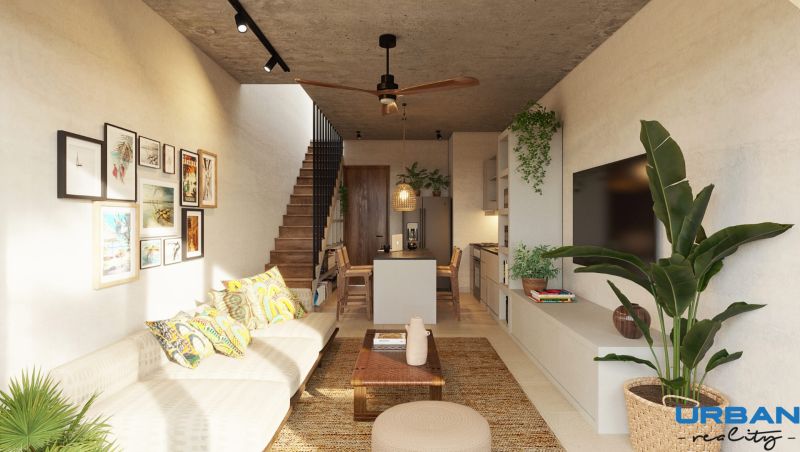 Living room in a two-room apartment with a comfortable sofa and decorative elements on the wall.