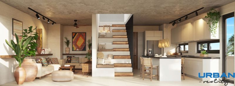 Living room of a two-room apartment with a kitchen, staircase, and plants.