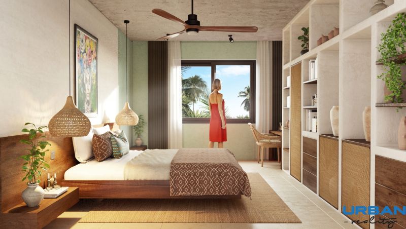 A bedroom in a 2-room apartment with natural elements and a view of palm trees.