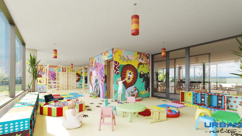 Children's corner with colorful paintings, toys, and playful furniture in a 2-room apartment.