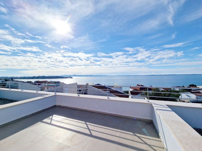 Sea view from the terrace of a 3-room apartment in Petrčane on a sunny day.